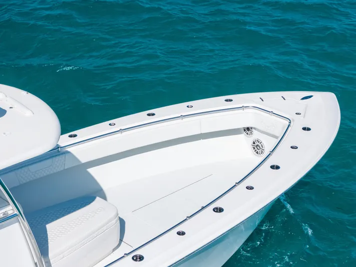  Yacht Photos Pics 2023 Contender 39 ST boat bow on clear blue water.