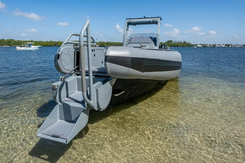  Yacht Photos Pics 2023 SAFE Boats Interceptor in shallow water with open rear ramp.