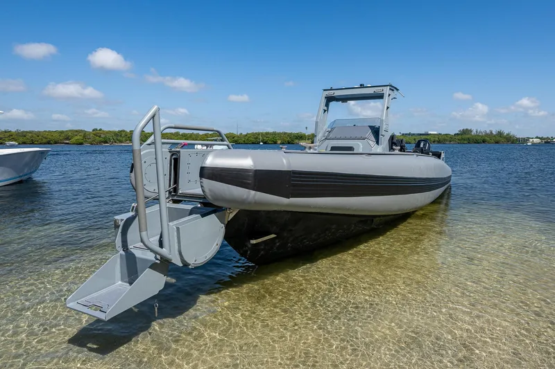  Yacht Photos Pics 2023 SAFE Boats Interceptor in shallow water, showcasing sleek design and advanced features.