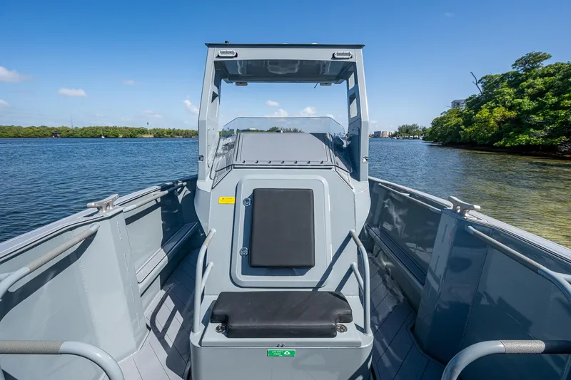  Yacht Photos Pics 2023 SAFE Boats Interceptor on water, showcasing sleek design and spacious deck.