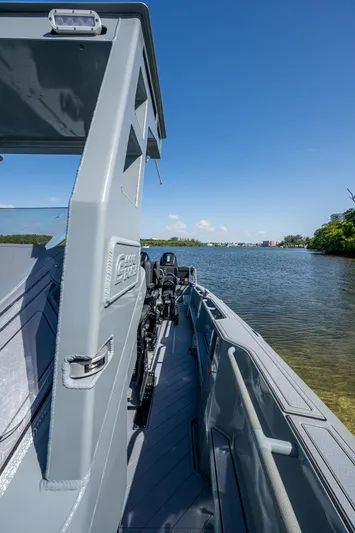  Yacht Photos Pics 2023 SAFE Boats Interceptor on calm water under clear blue sky.