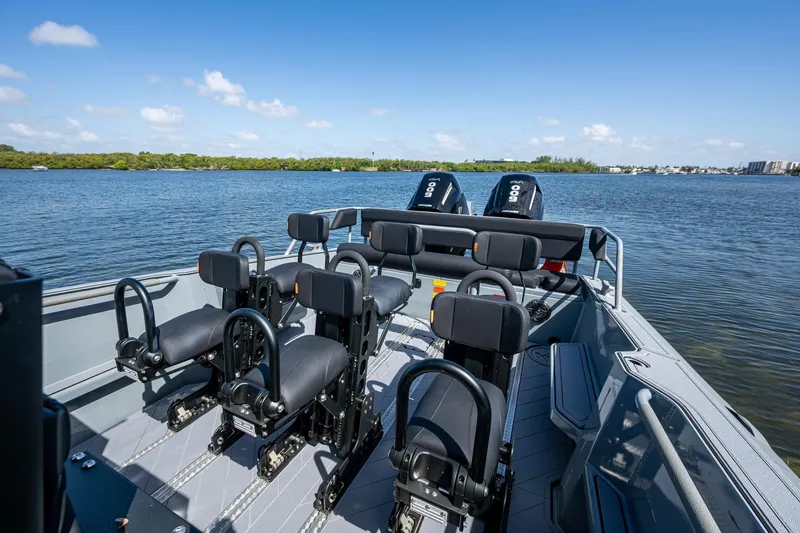  Yacht Photos Pics 2023 SAFE Boats Interceptor on water, featuring multiple seats and powerful engines.