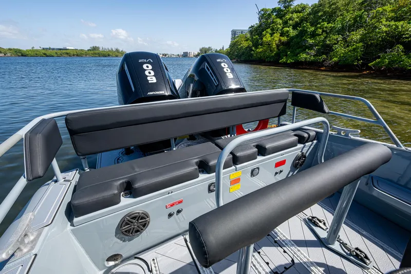  Yacht Photos Pics 2023 SAFE Boats Interceptor with dual Mercury 900 engines on a calm river.
