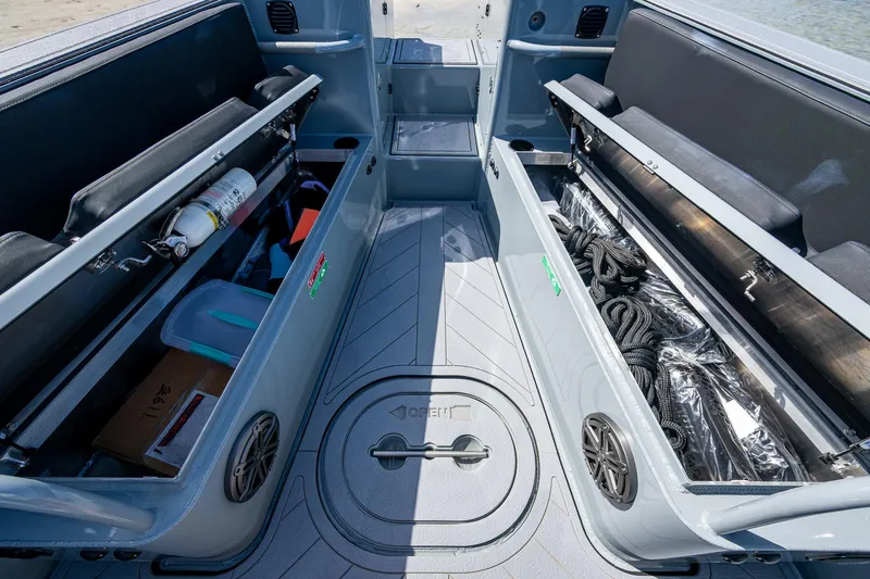  Yacht Photos Pics 2023 SAFE Boats Interceptor interior storage compartments with equipment and supplies.