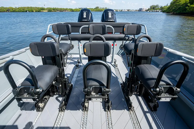  Yacht Photos Pics 2023 SAFE Boats Interceptor interior with seating, on a calm waterway.