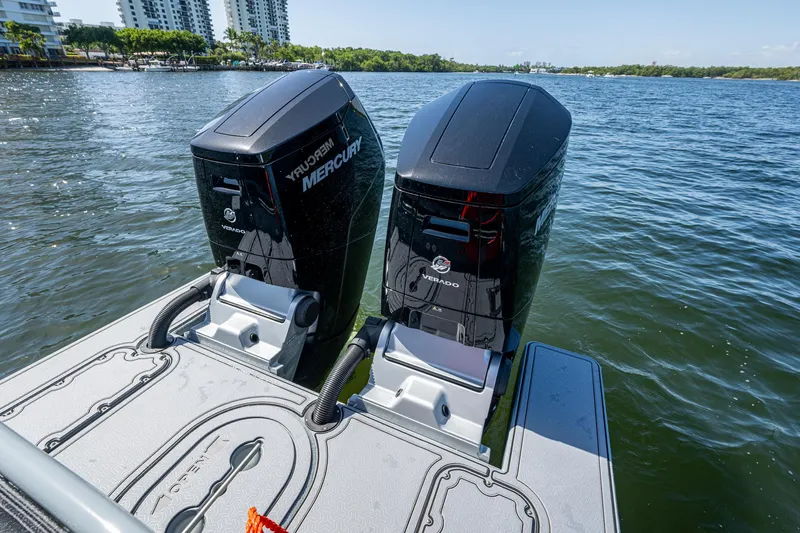  Yacht Photos Pics 2023 SAFE Boats Interceptor with dual Mercury Verado engines on a calm water backdrop.