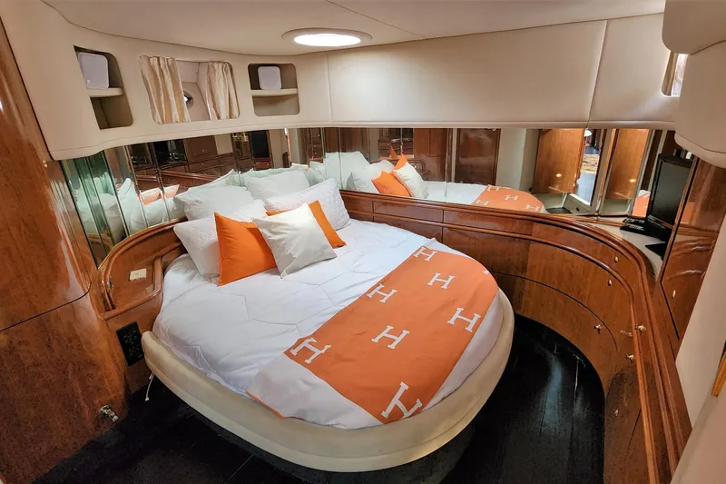Euphoria 1 Yacht Photos Pics Luxurious bedroom interior of 2000 Sea Ray 540 Sundancer yacht with elegant bedding.