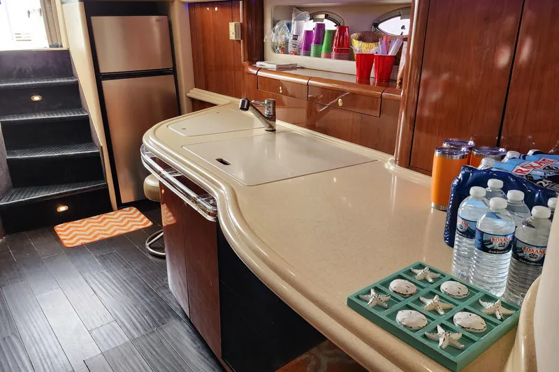 Euphoria 1 Yacht Photos Pics Luxurious 2000 Sea Ray 540 Sundancer yacht interior with modern kitchen and elegant wood finishes.