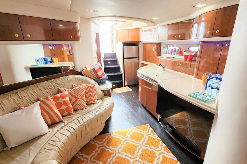 Euphoria 1 Yacht Photos Pics Luxurious interior of 2000 Sea Ray 540 Sundancer yacht with modern kitchen and cozy seating.