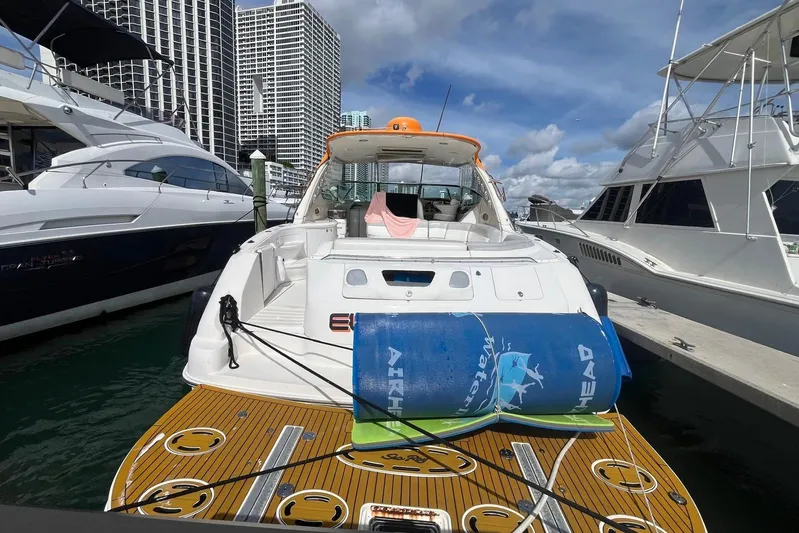 Euphoria 1 Yacht Photos Pics 2000 Sea Ray 540 Sundancer yacht docked at marina, surrounded by other boats.
