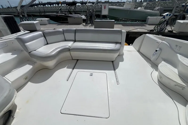 Euphoria 1 Yacht Photos Pics Spacious deck of 2000 Sea Ray 540 Sundancer with white seating and marina view.