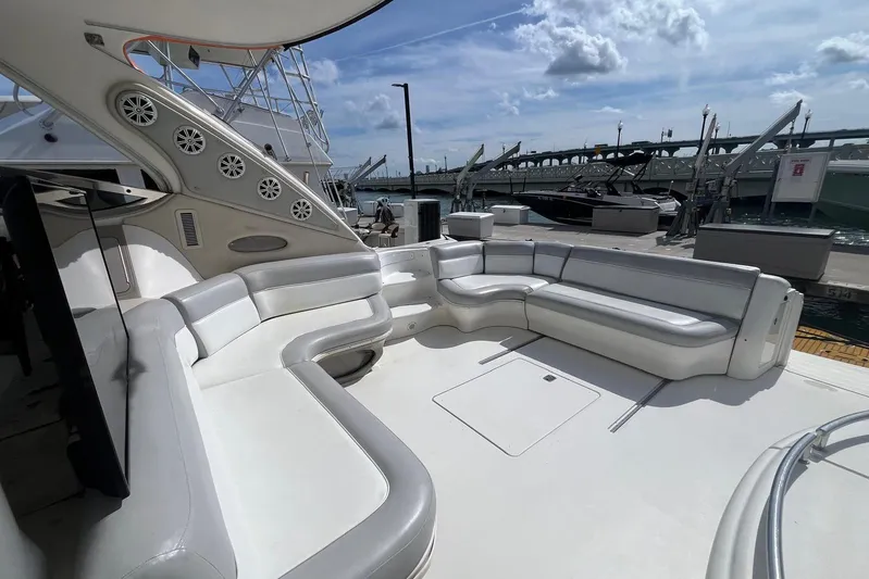 Euphoria 1 Yacht Photos Pics Luxurious seating area on a 2000 Sea Ray 540 Sundancer yacht docked at a marina.