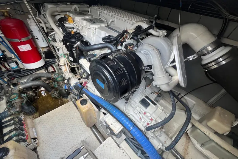 Euphoria 1 Yacht Photos Pics Engine room of 2000 Sea Ray 540 Sundancer with visible components and fire extinguisher.