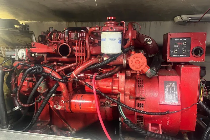 Euphoria 1 Yacht Photos Pics Engine room of a 2000 Sea Ray 540 Sundancer with a red Westerbeke generator.