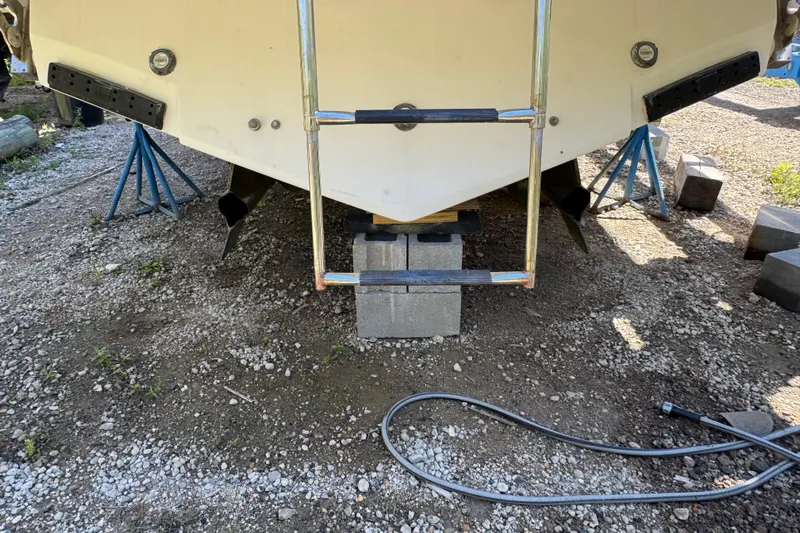  Yacht Photos Pics 2006 Formula 40 Performance Cruiser on blocks, rear view with ladder and supports.