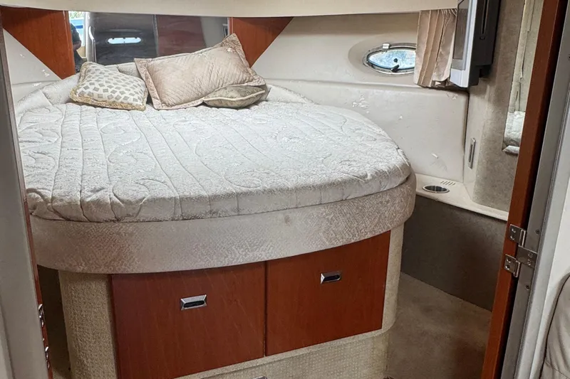  Yacht Photos Pics Cozy bedroom in 2006 Formula 40 Performance Cruiser with plush bedding and wooden accents.