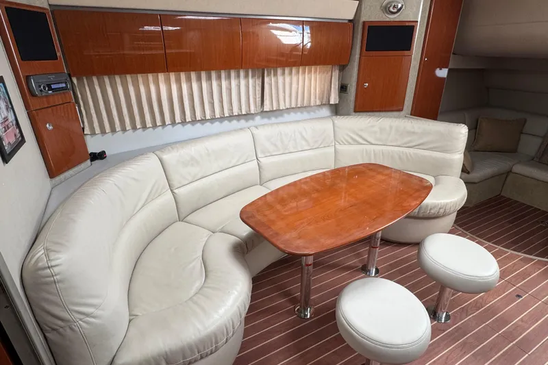  Yacht Photos Pics Interior of 2006 Formula 40 Performance Cruiser with leather seating and wooden table.