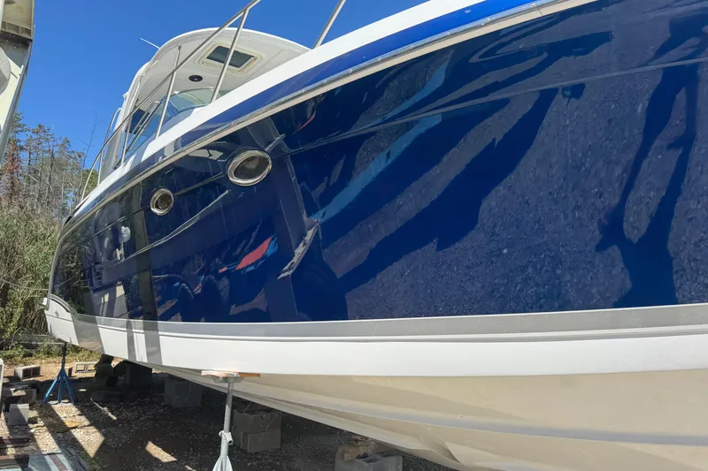  Yacht Photos Pics 2006 Formula 40 Performance Cruiser with sleek blue hull, docked outdoors.