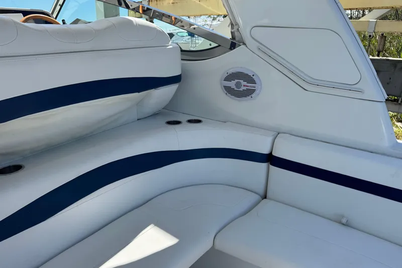  Yacht Photos Pics Interior seating of a 2006 Formula 40 Performance Cruiser with blue accents and speaker.