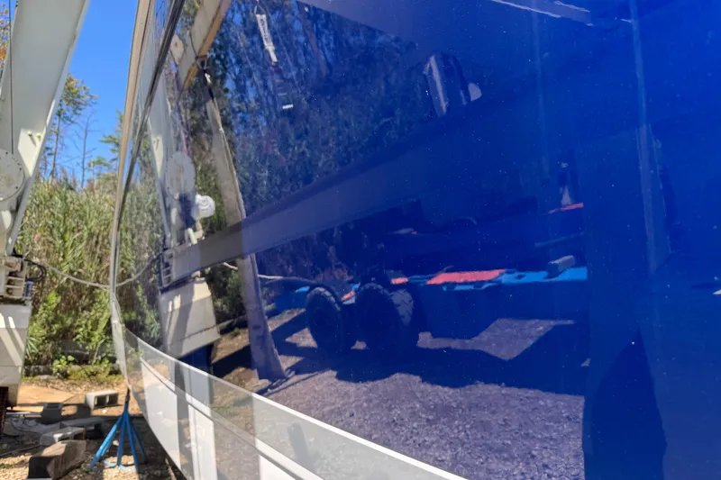  Yacht Photos Pics 2006 Formula 40 Performance Cruiser with glossy blue hull, docked outdoors.