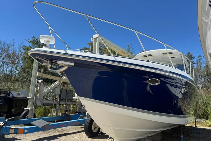  Yacht Photos Pics 2006 Formula 40 Performance Cruiser on trailer, blue hull, outdoor setting.