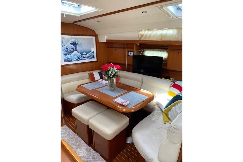 Kolibri Yacht Photos Pics Luxurious interior of 2006 Jeanneau Sun Odyssey 45 yacht with elegant dining area.