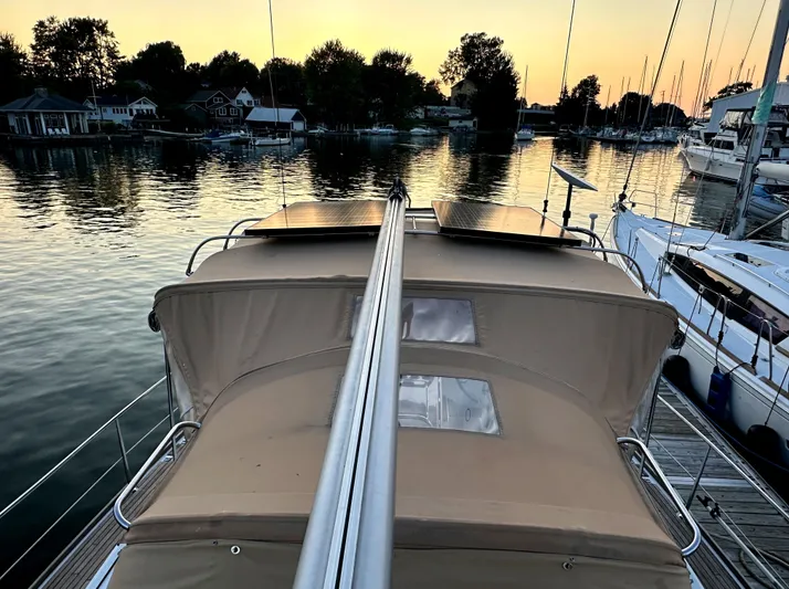 Star IV Yacht Photos Pics Jeanneau Sun Odyssey 50 DS sailboat docked at sunset, 2010 model.