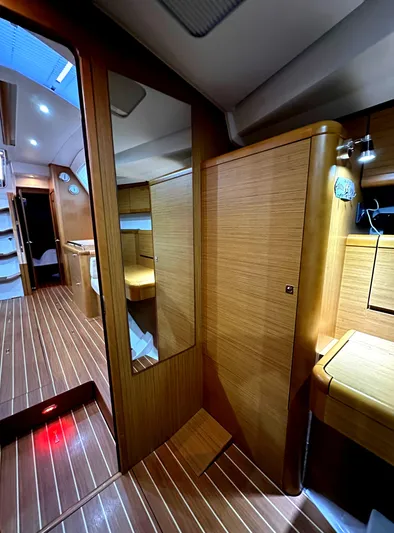 Star IV Yacht Photos Pics Interior of 2010 Jeanneau Sun Odyssey 50 DS, featuring sleek wood paneling and modern design.