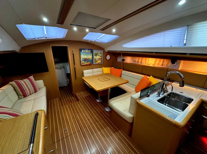 Star IV Yacht Photos Pics Luxurious interior of 2010 Jeanneau Sun Odyssey 50 DS yacht with modern amenities.
