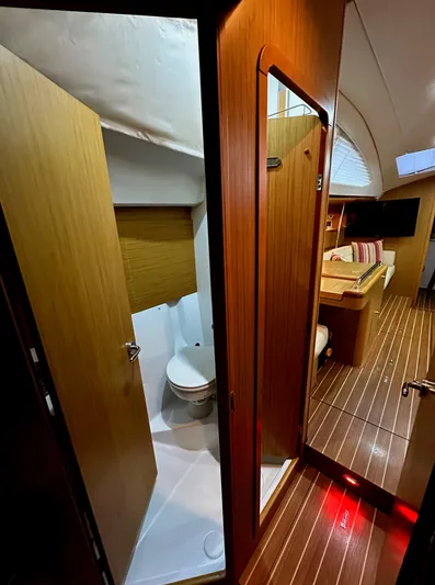 Star IV Yacht Photos Pics Interior of 2010 Jeanneau Sun Odyssey 50 DS yacht, featuring bathroom and cabin area.