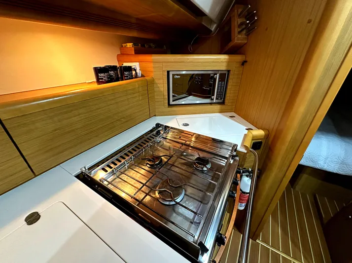 Star IV Yacht Photos Pics Galley kitchen in 2010 Jeanneau Sun Odyssey 50 DS sailboat with stove and microwave.