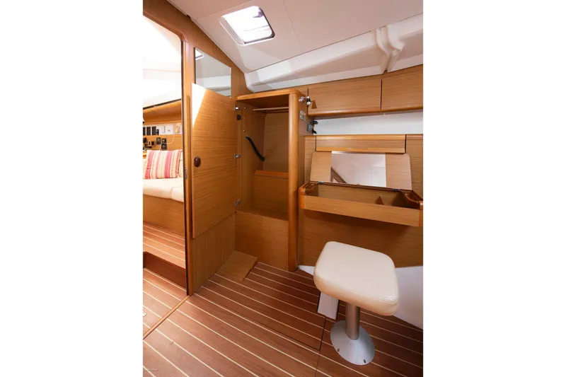 Star IV Yacht Photos Pics Interior of 2010 Jeanneau Sun Odyssey 50 DS, featuring wooden cabinetry and seating.