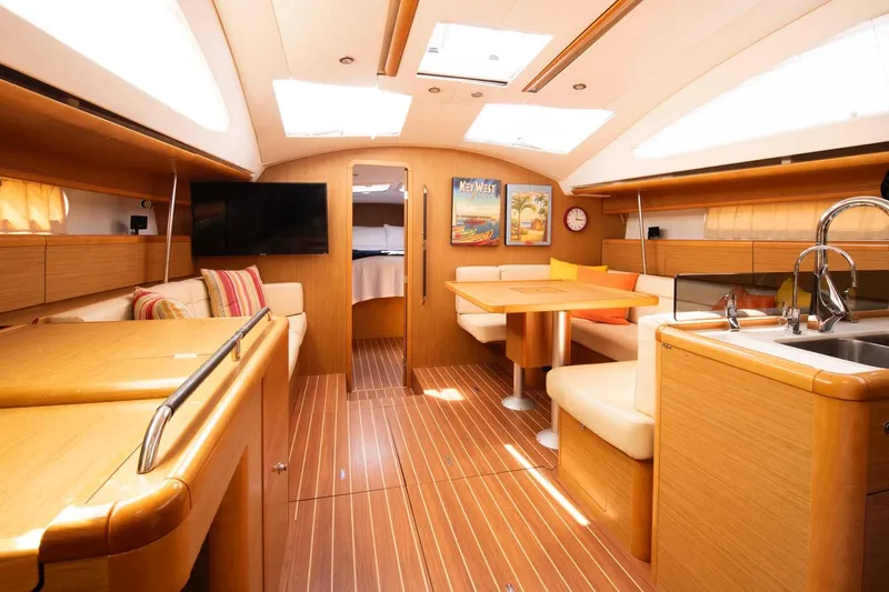 Star IV Yacht Photos Pics Luxurious interior of 2010 Jeanneau Sun Odyssey 50 DS yacht with modern amenities.