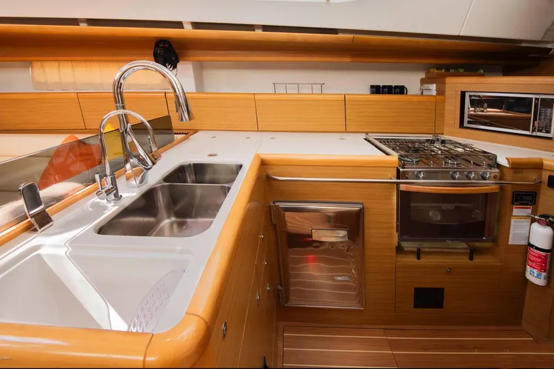Star IV Yacht Photos Pics Modern kitchen in 2010 Jeanneau Sun Odyssey 50 DS yacht with stainless steel appliances.