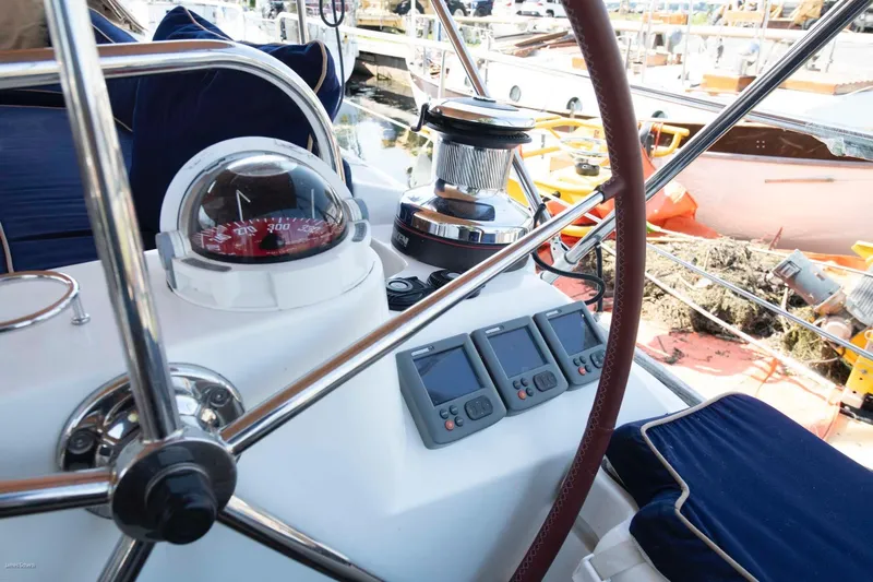 Star IV Yacht Photos Pics Cockpit of 2010 Jeanneau Sun Odyssey 50 DS with compass and navigation instruments.