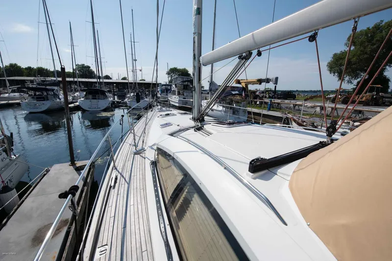 Star IV Yacht Photos Pics 2010 Jeanneau Sun Odyssey 50 DS sailboat docked at marina, sunny day.