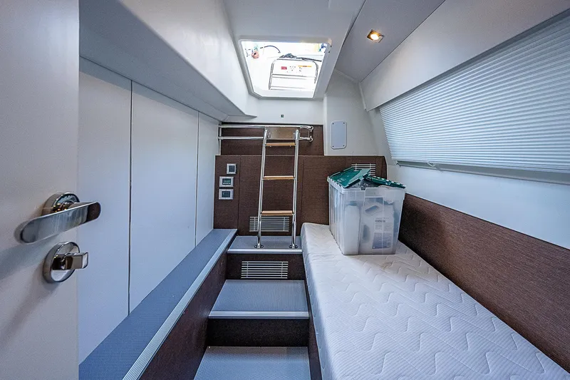 Miss K Yacht Photos Pics Interior cabin of 2022 Prestige 520 Fly yacht with bed and storage.