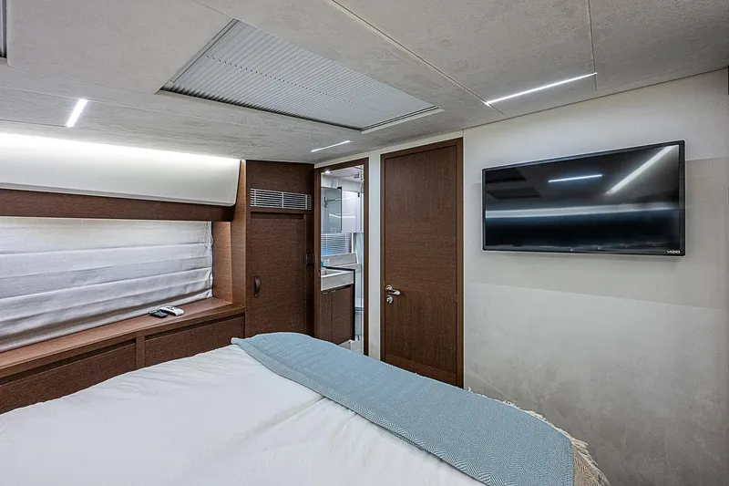 Miss K Yacht Photos Pics Luxurious bedroom interior of 2022 Prestige 520 Fly yacht with modern amenities.