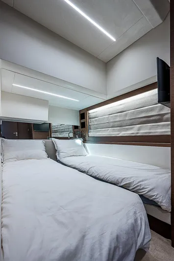 Miss K Yacht Photos Pics Luxurious cabin interior of 2022 Prestige 520 Fly yacht with modern bedding and lighting.