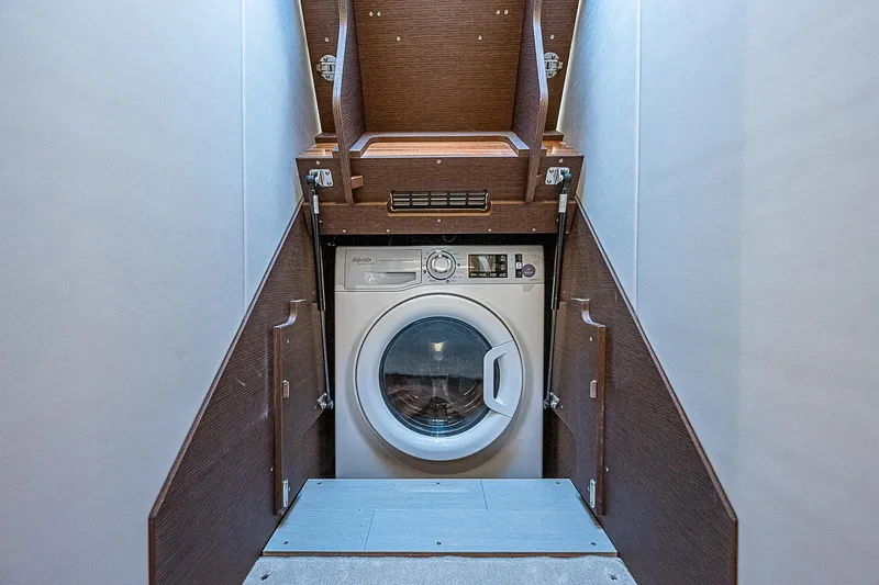 Miss K Yacht Photos Pics Washing machine in 2022 Prestige 520 Fly yacht interior, wooden cabinetry.