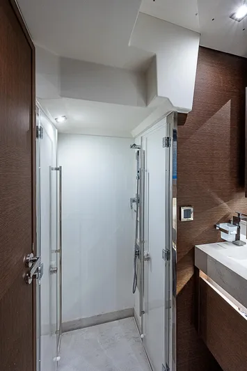 Miss K Yacht Photos Pics Modern bathroom interior on 2022 Prestige 520 Fly yacht, featuring sleek design and glass shower.