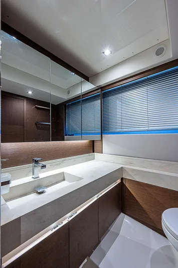 Miss K Yacht Photos Pics Luxurious bathroom interior of 2022 Prestige 520 Fly yacht with modern fixtures and sleek design.