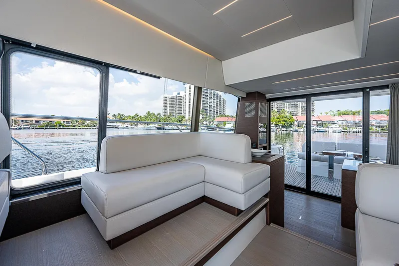 Miss K Yacht Photos Pics Luxurious interior of 2022 Prestige 520 Fly yacht with waterfront view.