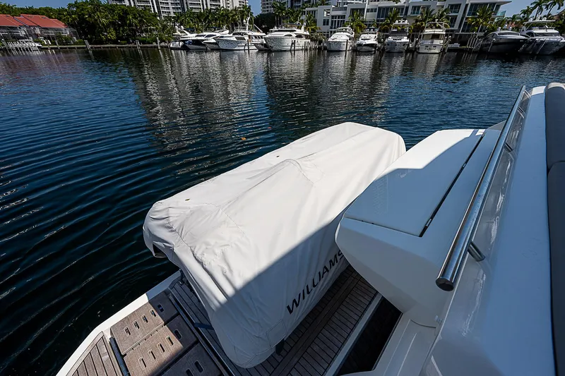 Miss K Yacht Photos Pics Prestige 520 Fly 2022 yacht with covered equipment on deck, docked near waterfront.