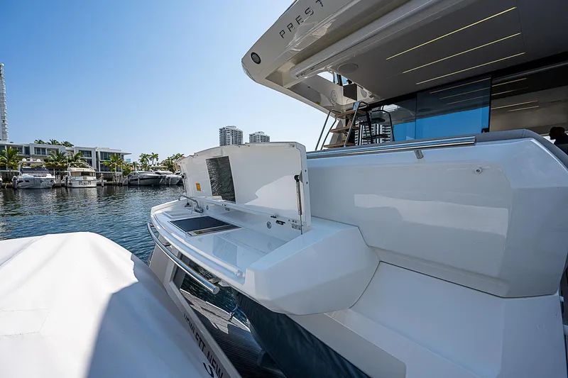 Miss K Yacht Photos Pics 2022 Prestige 520 Fly yacht docked at marina, showcasing sleek design and modern amenities.