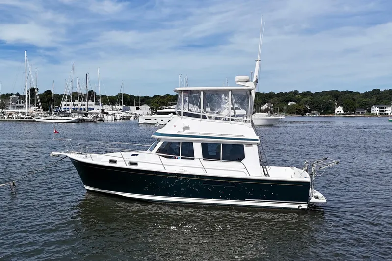 Daystar Yacht Photos Pics 2001 Sabre Sabreline 34 yacht docked in a scenic marina setting.