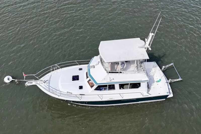Daystar Yacht Photos Pics 2001 Sabre Sabreline 34 boat on water, aerial view, white and blue design.