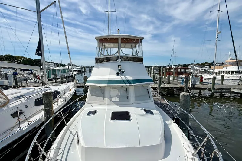 Daystar Yacht Photos Pics 2001 Sabre Sabreline 34 yacht docked at a marina under a clear sky.