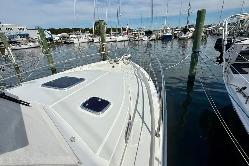 Daystar Yacht Photos Pics 2001 Sabre Sabreline 34 yacht docked at a marina, surrounded by other boats.