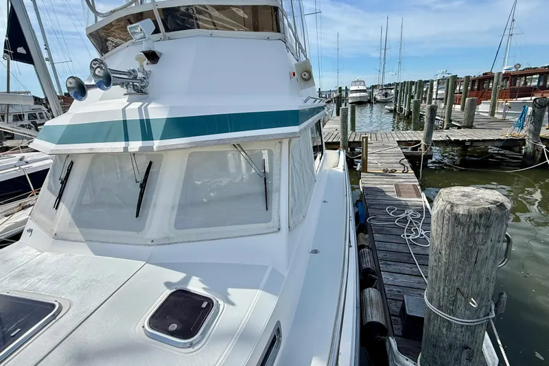 Daystar Yacht Photos Pics 2001 Sabre Sabreline 34 docked at marina, showcasing sleek design and nautical features.